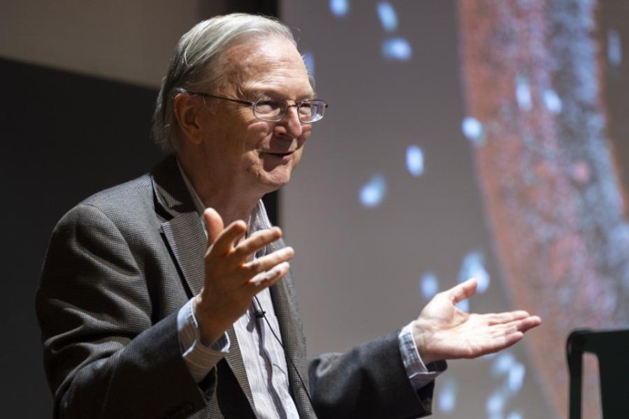 person with screen behind