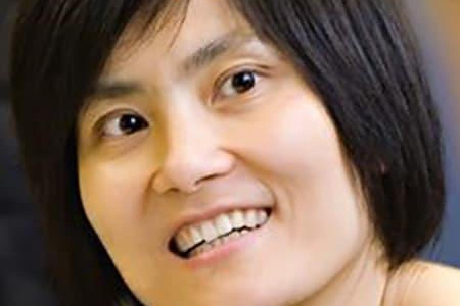 Jane Wang's face, with short dark hair and a smile.
