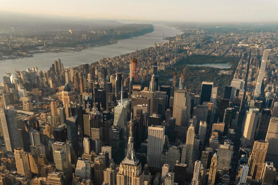 Sky scrapers rise from New York City in an aeriel shot