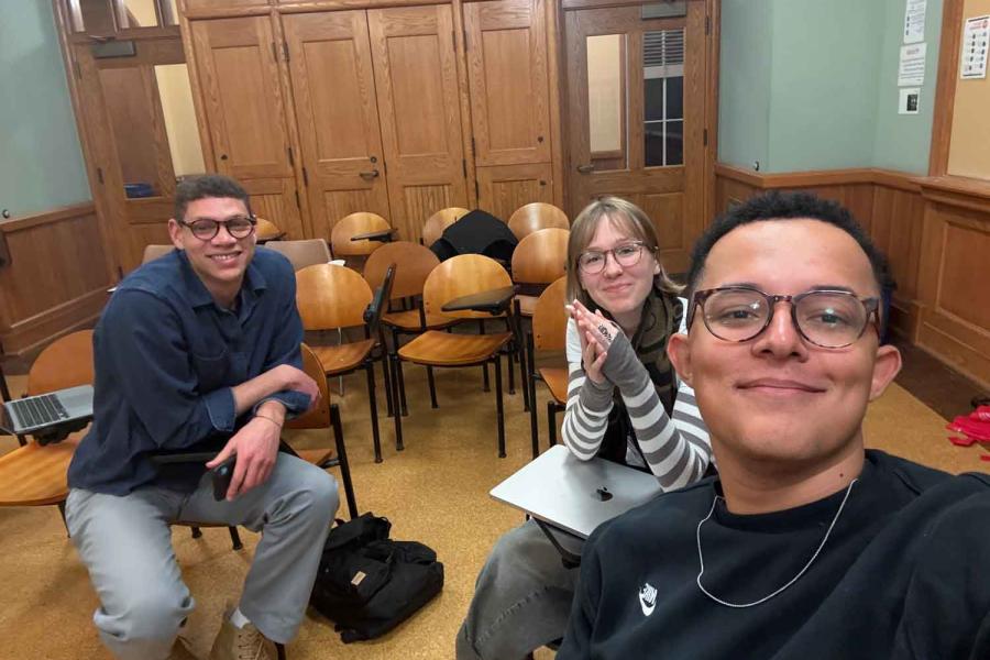 three people in a classroom