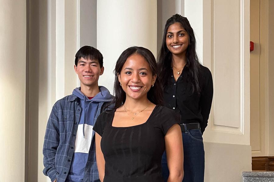 three people smiling