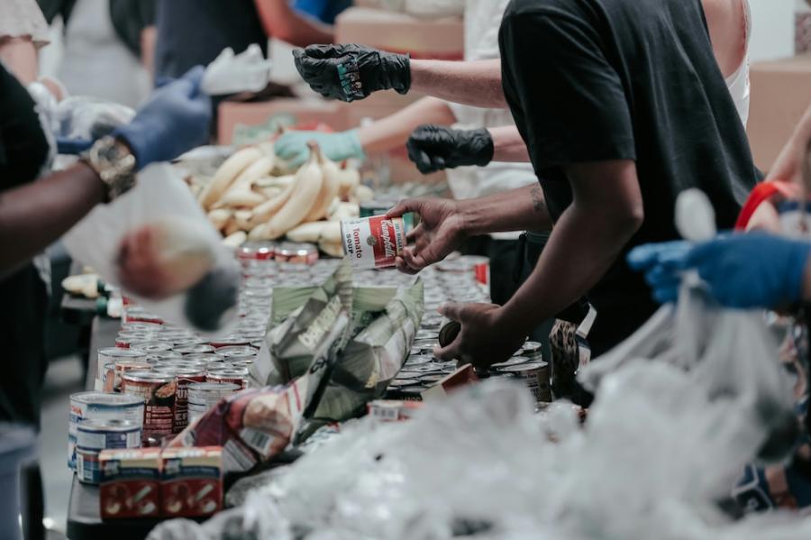 Many people working together to package food