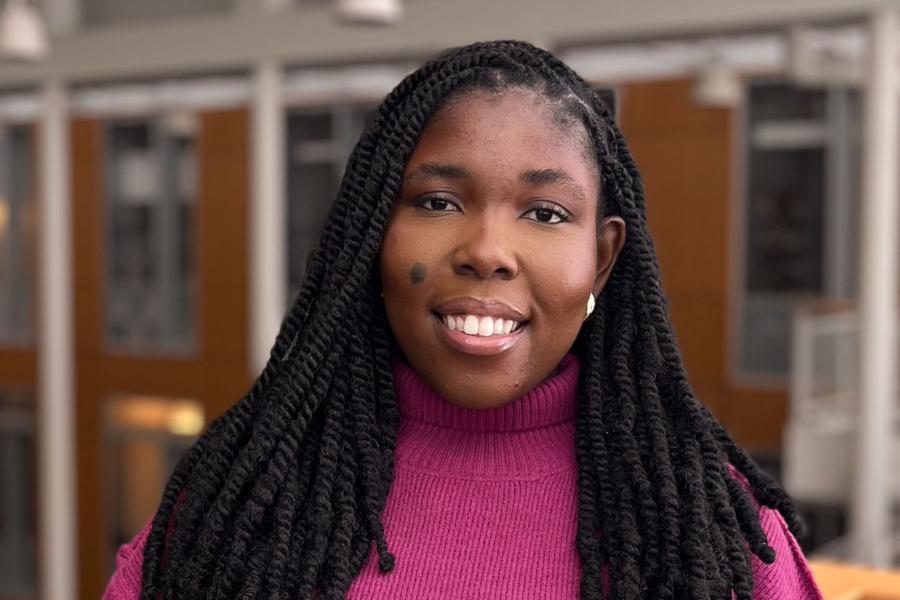 Student standing in front of railing