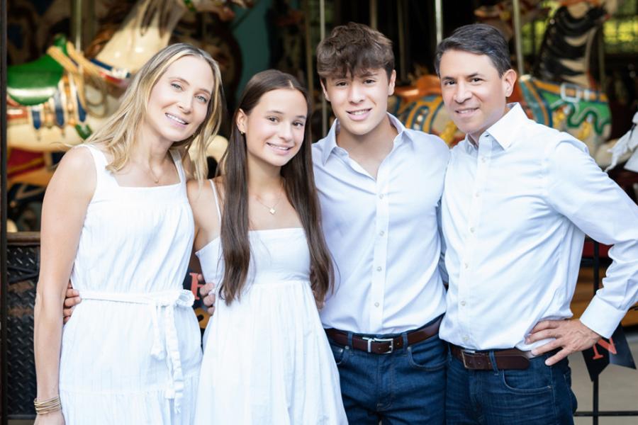 A family of four in a posed picture