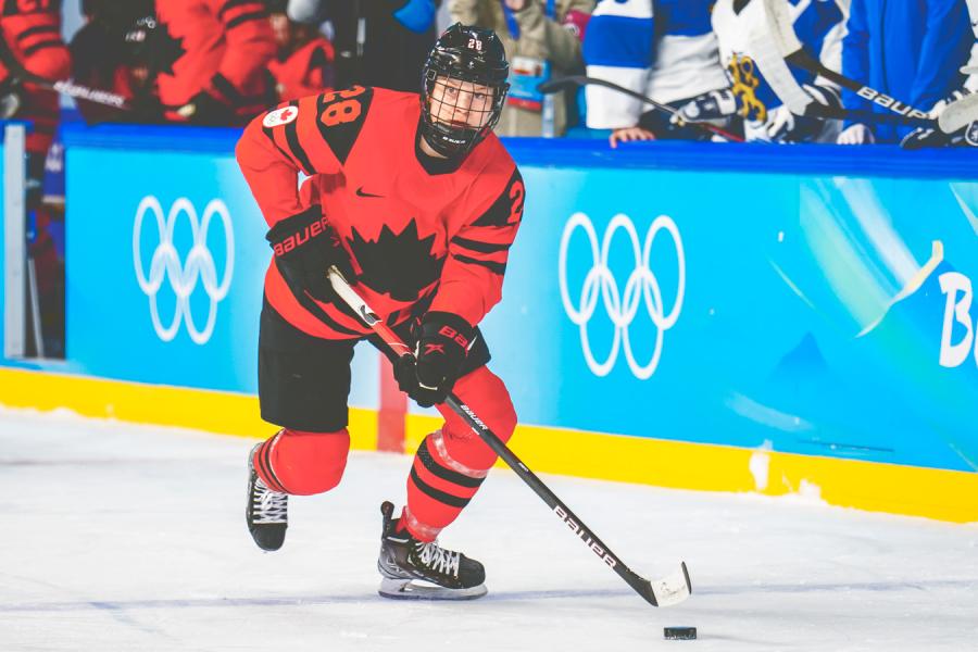Hockey player in red and black uniform