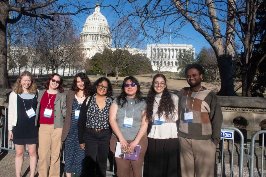 people standing in front of the Capitol building in D.C.