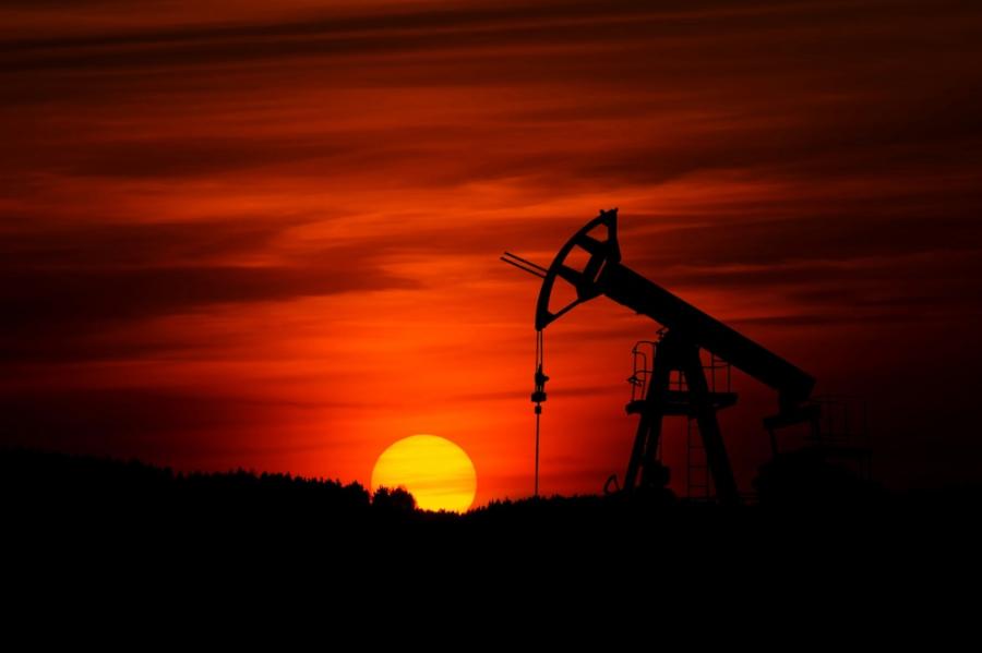 Sunset with a pump mining crude oil