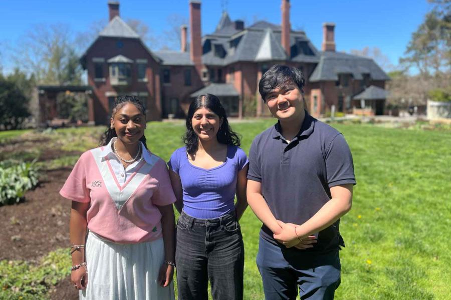 three people standing outside