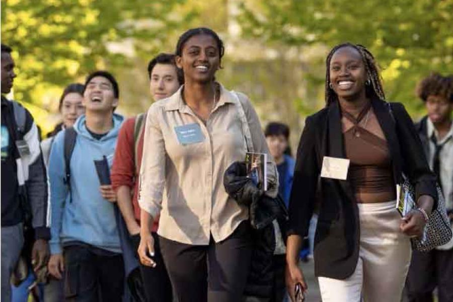 a group of people walking outside