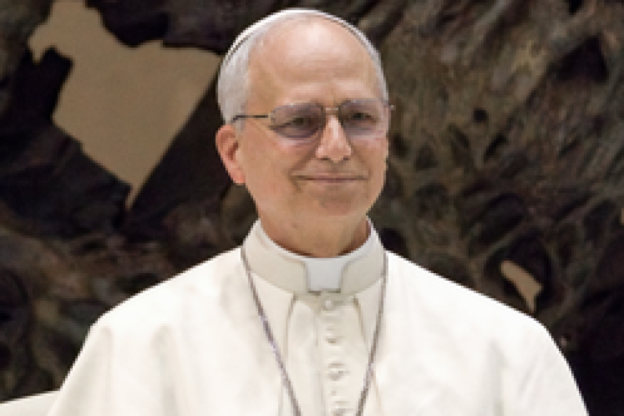 Pope Leo, in all white-clothes and wearing a big cross