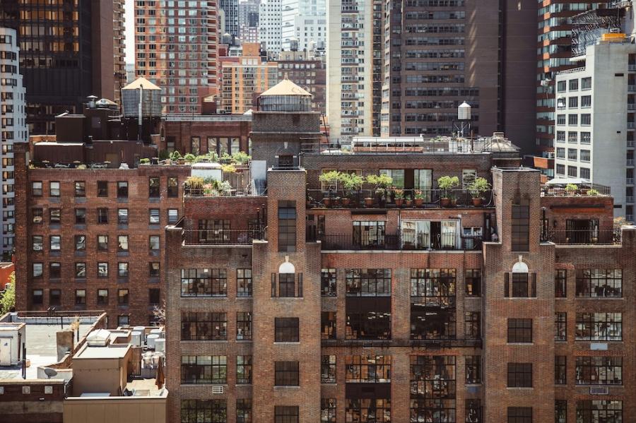 layers of brick and glass buildings in a city