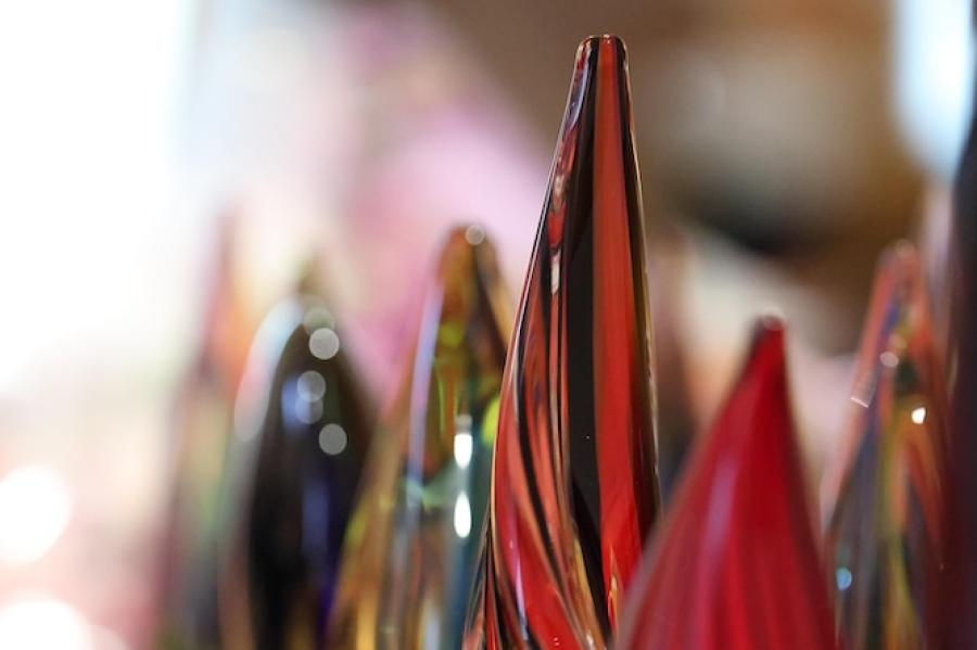 Glass sculptures arranged on a tabletop, about to be given as awards