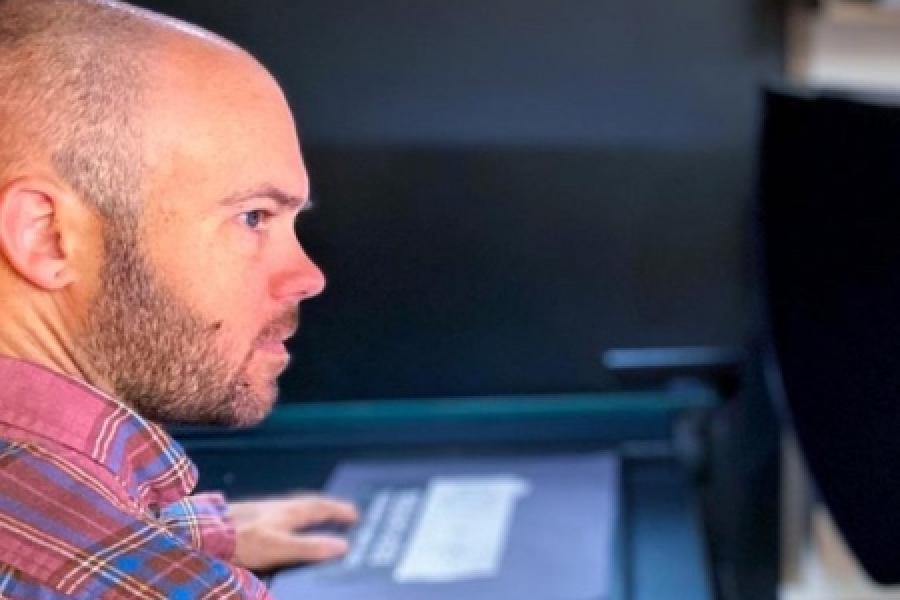 Researcher working on a computer