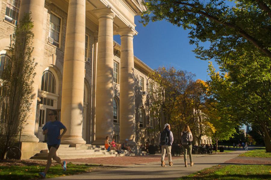  Students walk past Goldwin Smith Hall in the fall