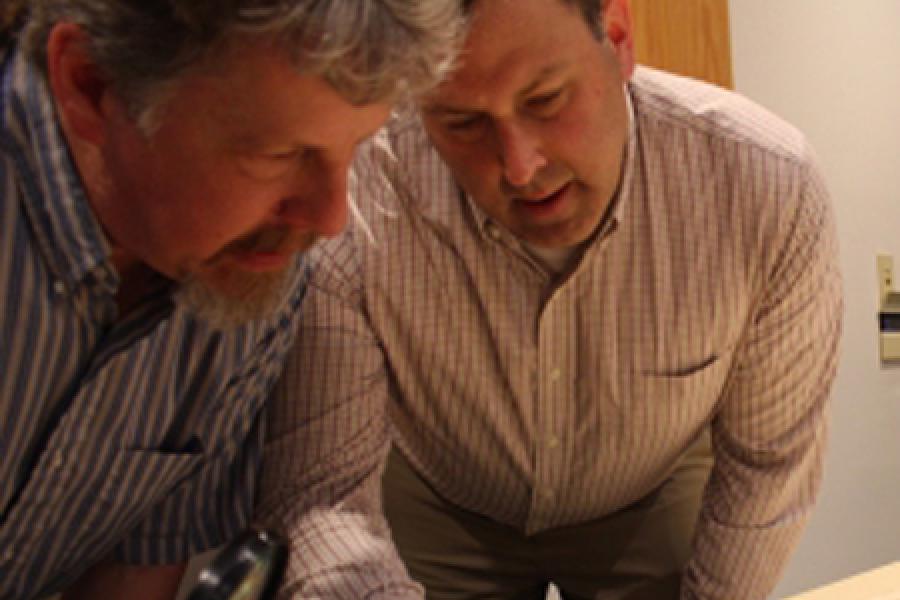  Two men looking at a map