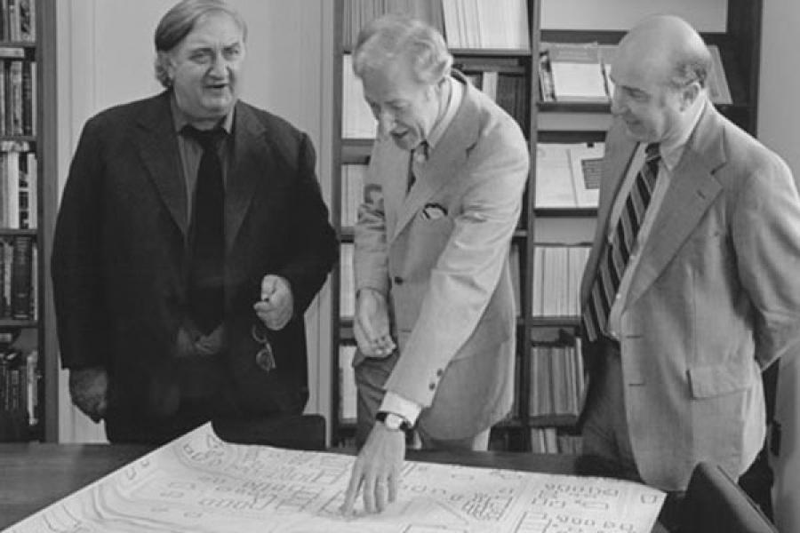 From left, James Stirling, architect of the Schwartz Center for the Performing Arts, then-President Frank H.T. Rhodes, and Alain Seznec look at plans for the center in 1984.