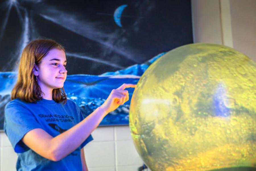 Moravia student Taryn Langtry at Cornell’s Spacecraft Planetary Imaging Facility.