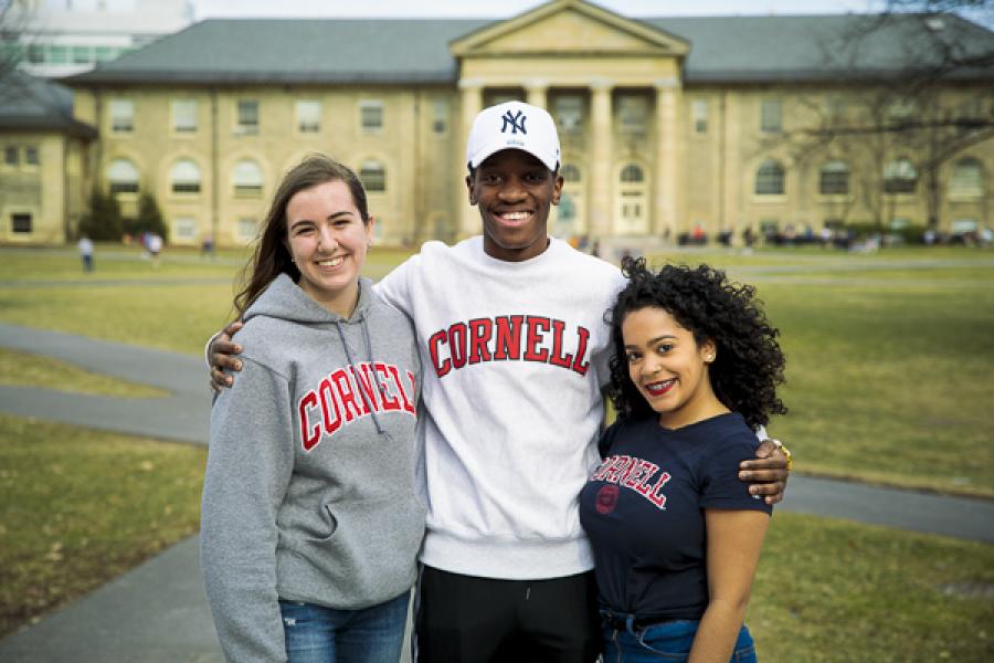  Three students pose in front of Goldwin Smith Hall