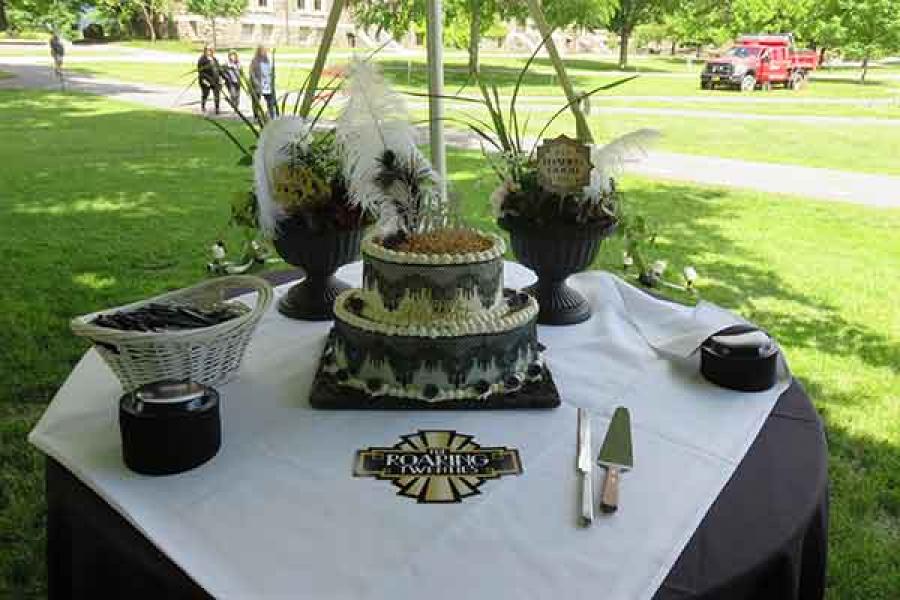 Cake for honorees with feathers and decorations