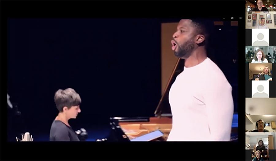 man singing and woman playing piano