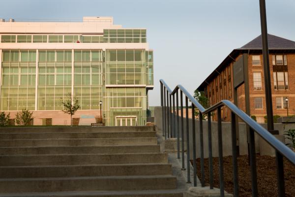 Glass panel building in background with stairs in foreground. 