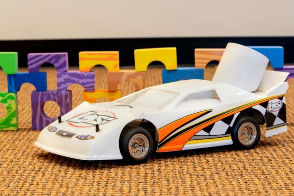 Toy car in front of colored blocks