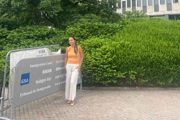 person standing in front of a building