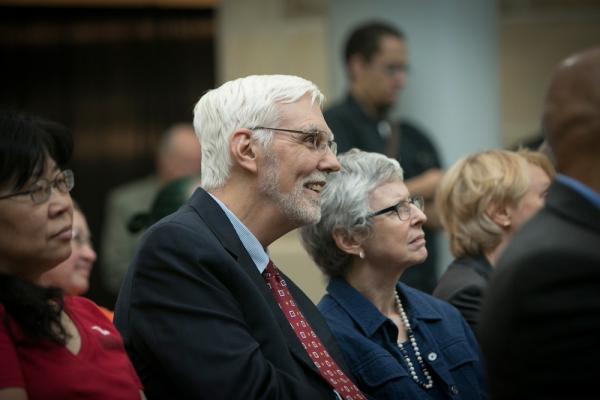 Person in profile; he's part of an audience