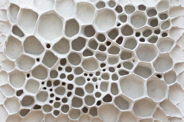 Three dimensional art piece; a honeycomb like construction of white clay