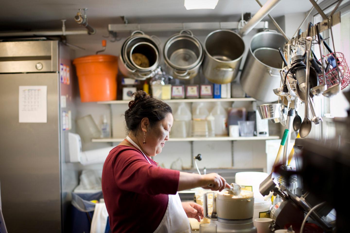 Choklay Lhamo cooking in the Zeus kitchen