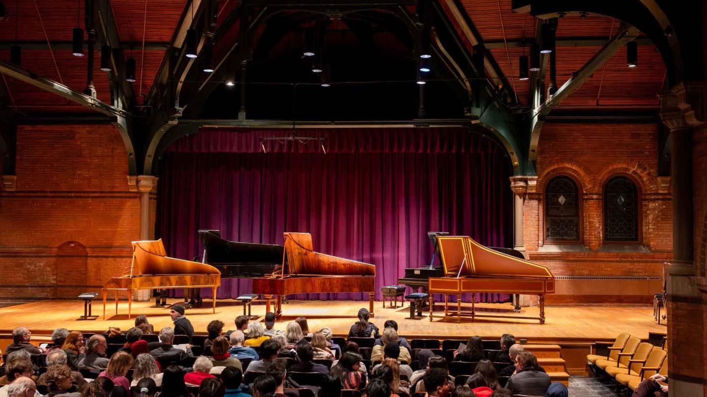 three pianos on a stage