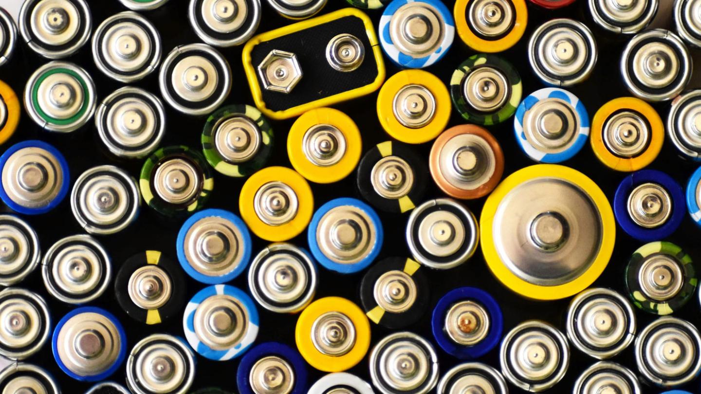 A group of many batteries with the positive side up