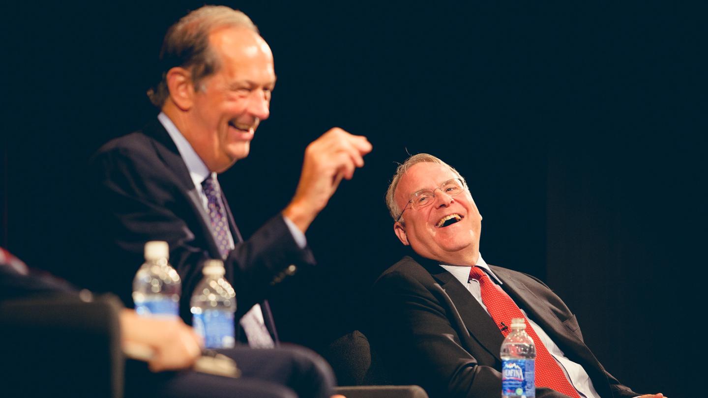 Two people laughing together